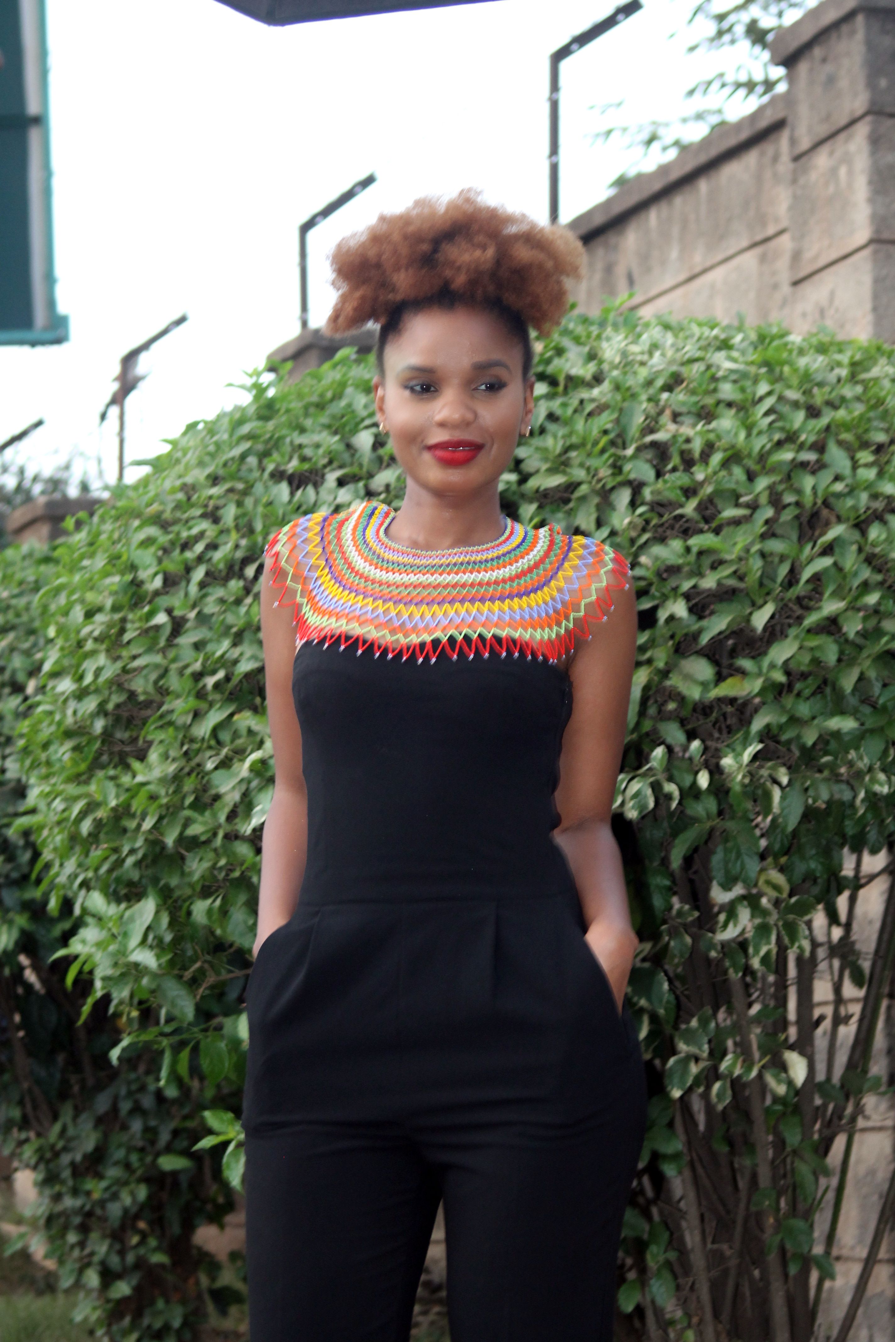 black dress with african accessories